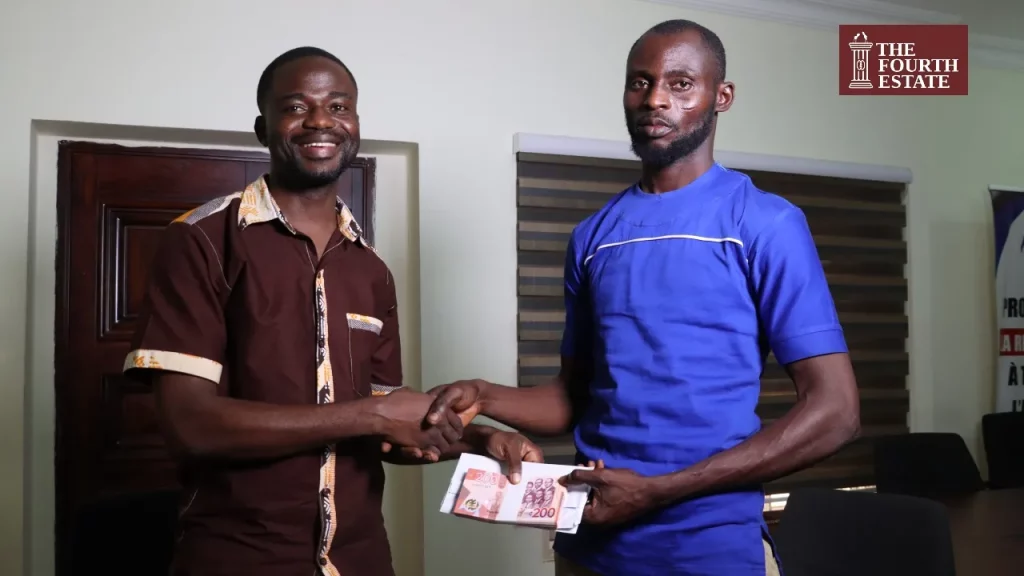 Taxi driver receives donation from Manasseh