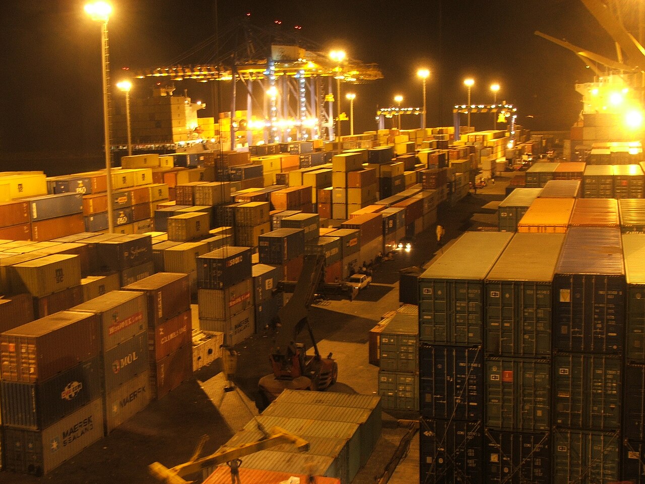Containers and logistics machinery at a freight port in Ghana