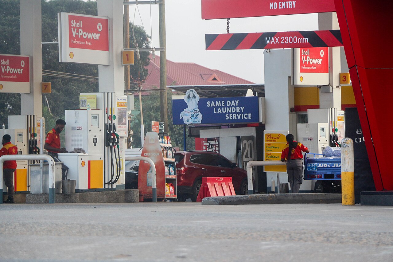 Commercial vehicles and motorists at a fuel station in Accra following policy changes