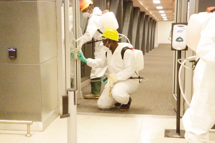 Travelers at Kotoka International Airport undergoing enhanced NACOC security screening in Accra
